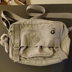 Grey watermarked Kipling bag
